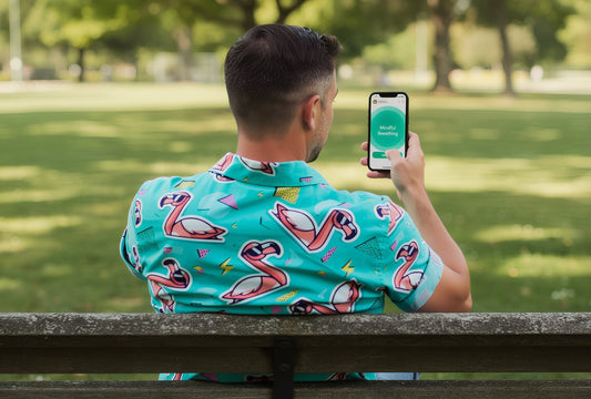 Man Wearing Flamingo Fandango Shirt Using a Mental Health App
