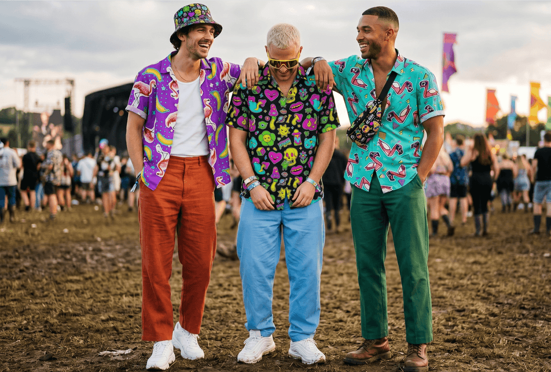 3 men at a festival wearing shit shirts 