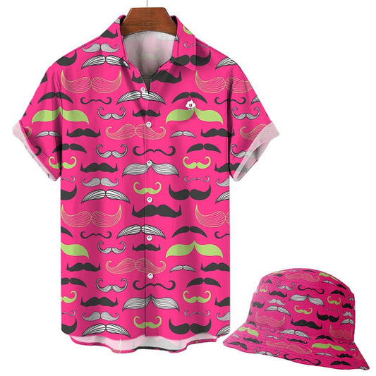 A bright pink Movember Shirt with short sleeves, featuring a colorful mustache pattern, hangs on a hanger against a plain background. A matching bucket hat with the same playful design completes this bold look.