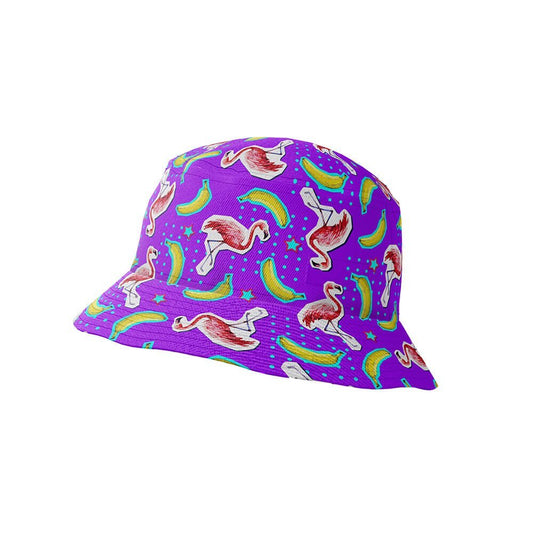 The Bananas For Flamingos Bucket Hat features a purple base adorned with playful pink flamingos, green bananas, and blue stars for a fun, vibrant look.