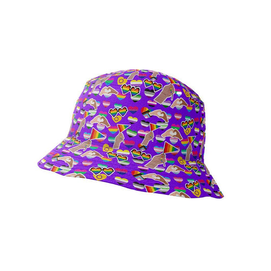 The LGBTQ Pride Bucket Hat features a vibrant purple background adorned with colorful hearts, sunglasses, rainbows, pride symbols, peace signs, and clouds in playful patterns.