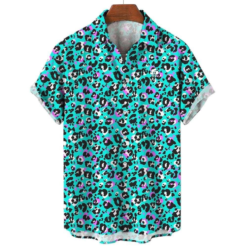 The Turquoise Tempest Leopard Print Shirt features short sleeves and a bold black, white, and purple leopard print—perfect for audacious style. Displayed on a wooden hanger, it’s a standout piece for any wardrobe.