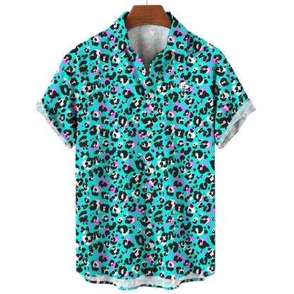 The Turquoise Tempest Leopard Print Shirt features short sleeves and a bold black, white, and purple leopard print—perfect for audacious style. Displayed on a wooden hanger, it’s a standout piece for any wardrobe.