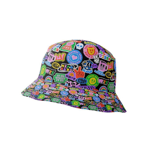 The Retro Sticker Bucket Hat features bright, cartoon-style patches and stickers—words, symbols, hearts, and smiley faces—on a black background for a playful 90s-inspired look.