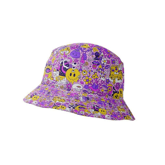 The Magical Psychedelic Bucket Hat features playful cartoon doodles in yellow, purple, and pink on white—complete with faces, flowers, and whimsical characters—making it the perfect vibrant accessory for festival fashion.