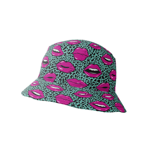 The Leopard Kiss Bad Bucket Hat showcases a teal leopard print with pink lips and open mouths, featuring white teeth. This unique festival hat is presented on a white background.