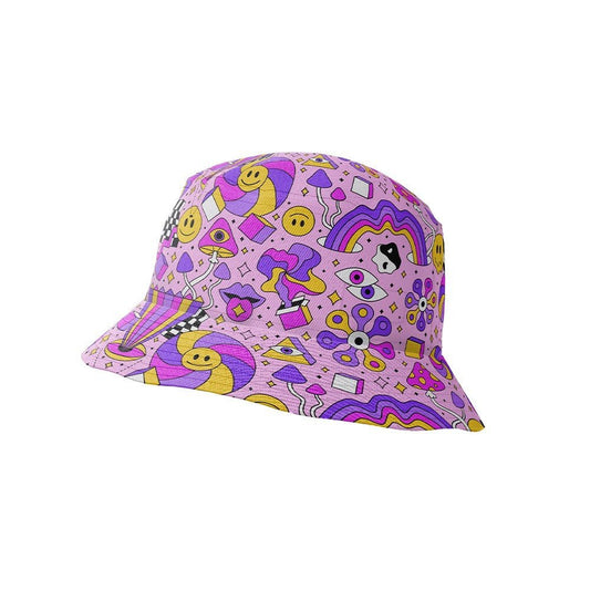 The Hippie Bucket Hat features a vibrant pattern with smiley faces, rainbows, stars, flowers, and playful doodles in yellow, purple, and pink on a light purple background—perfect for festivals.
