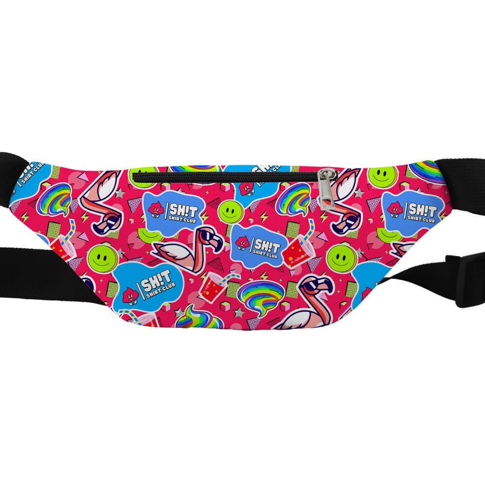 The Badass Bum Bag is a colourful, hands-free festival bag with a black strap, bright pink background, and patterns of flamingos, rainbows, smiley faces, “I SH!T SUNSHINE” stickers, and stars—perfect for any fun outing.