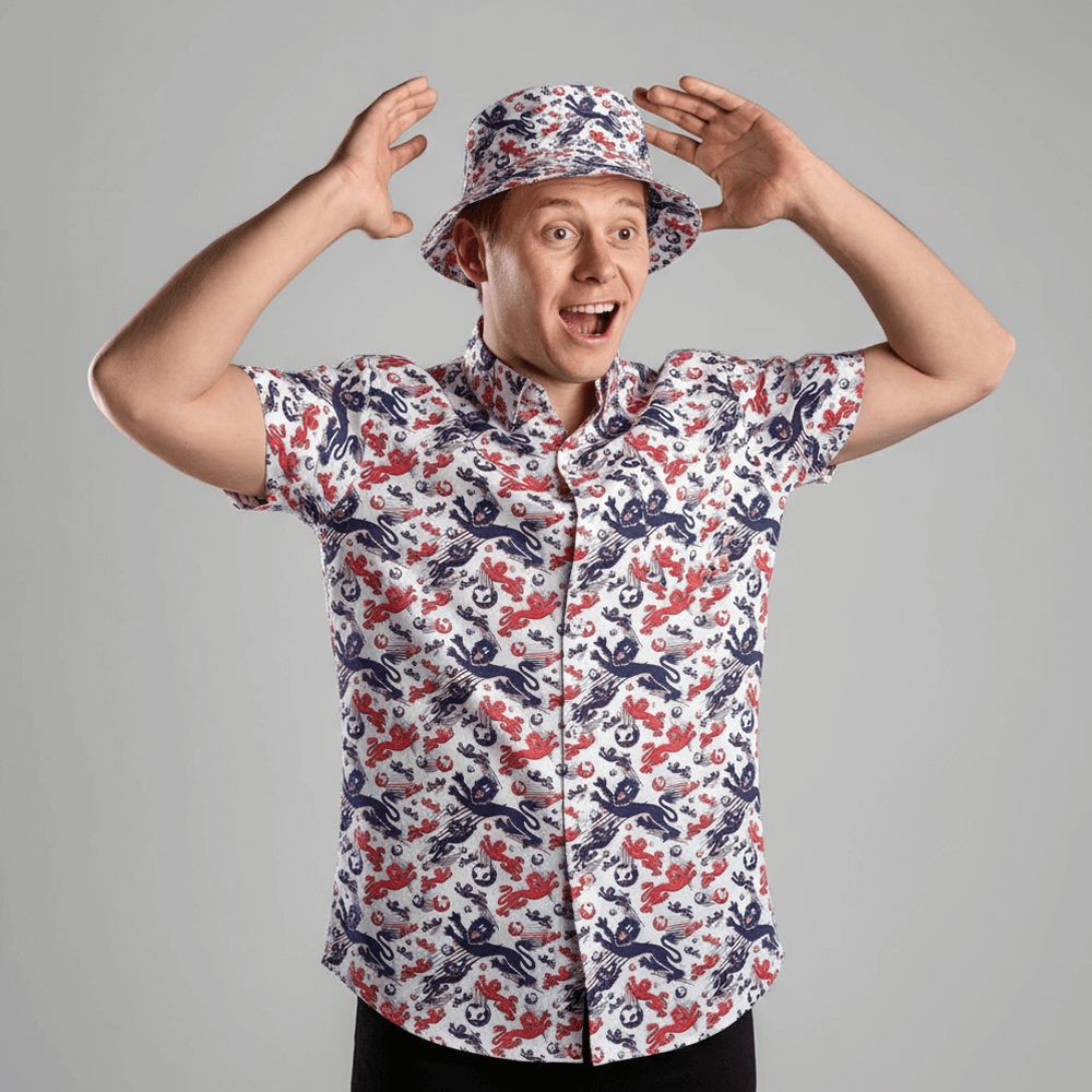 Person wearing the England Football Shit Shirt and matching bucket hat against a grey background 