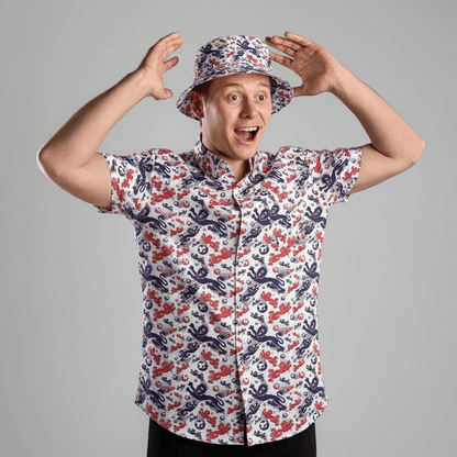 Person wearing the England Football Shit Shirt and matching bucket hat against a grey background 