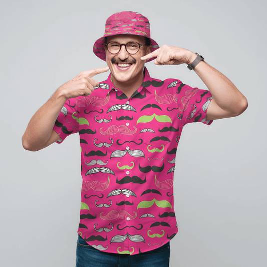Man wearing the Movember Shit Shirt and matching Movember Bucket Hat, pointing at his moustache 