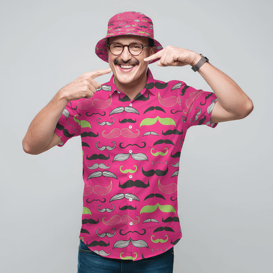 Man wearing the Movember Shit Shirt and matching Movember Bucket Hat, pointing at his moustache 