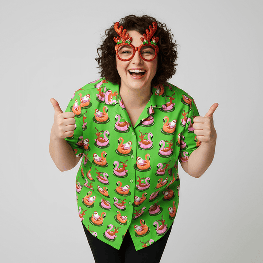 Woman wearing the Pool Party Shit Xmas Shirt and reindeer antler glasses doing thumbs up on a plain background
