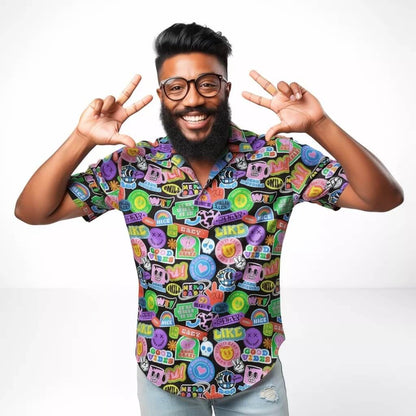 Man wearing a colourful patterned shirt making peace signs with his hands on a white background