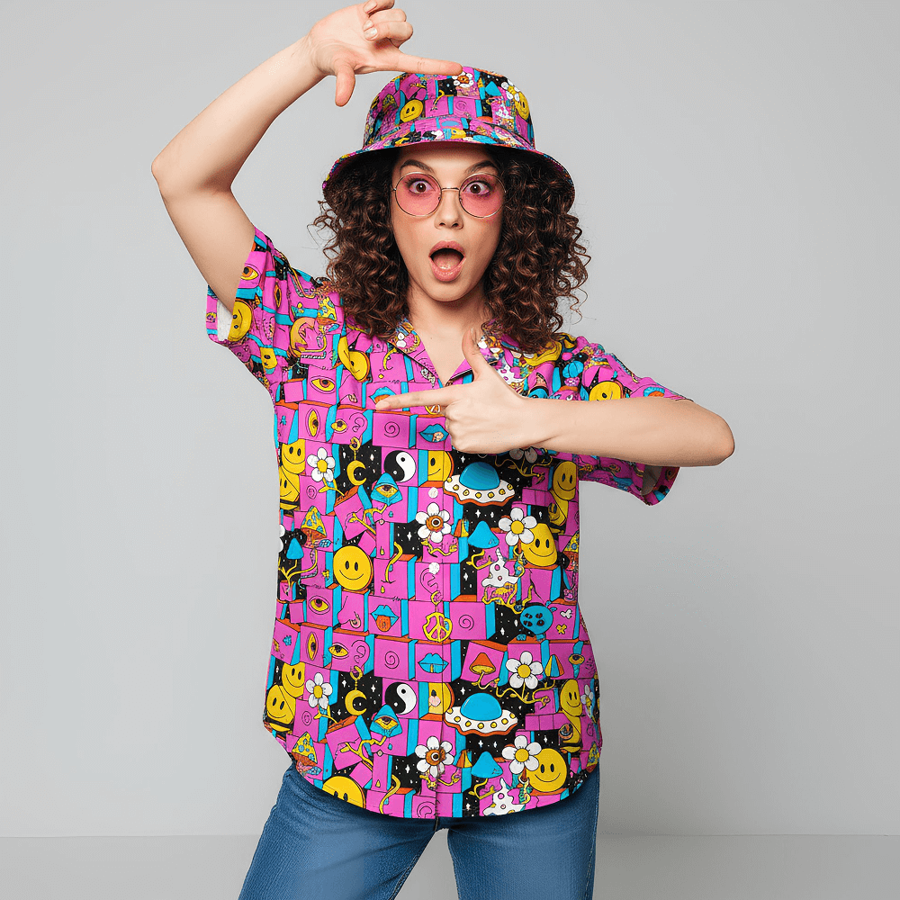 Woman wearing the Trippy Space Shit Shirt, matching Trippy Space Bucket Hat, and pink sunglasses, on a grey background