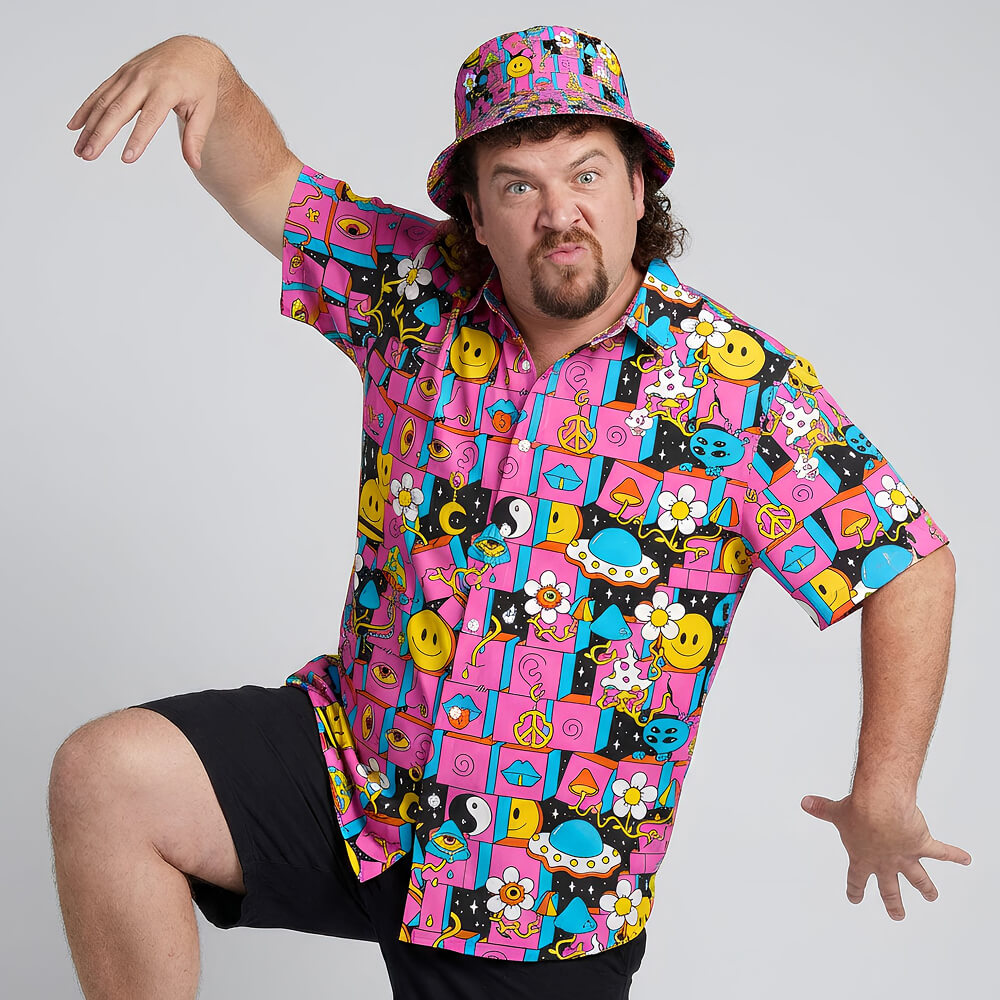 Person wearing a colourful patterned shirt and bucket hat on a plain background