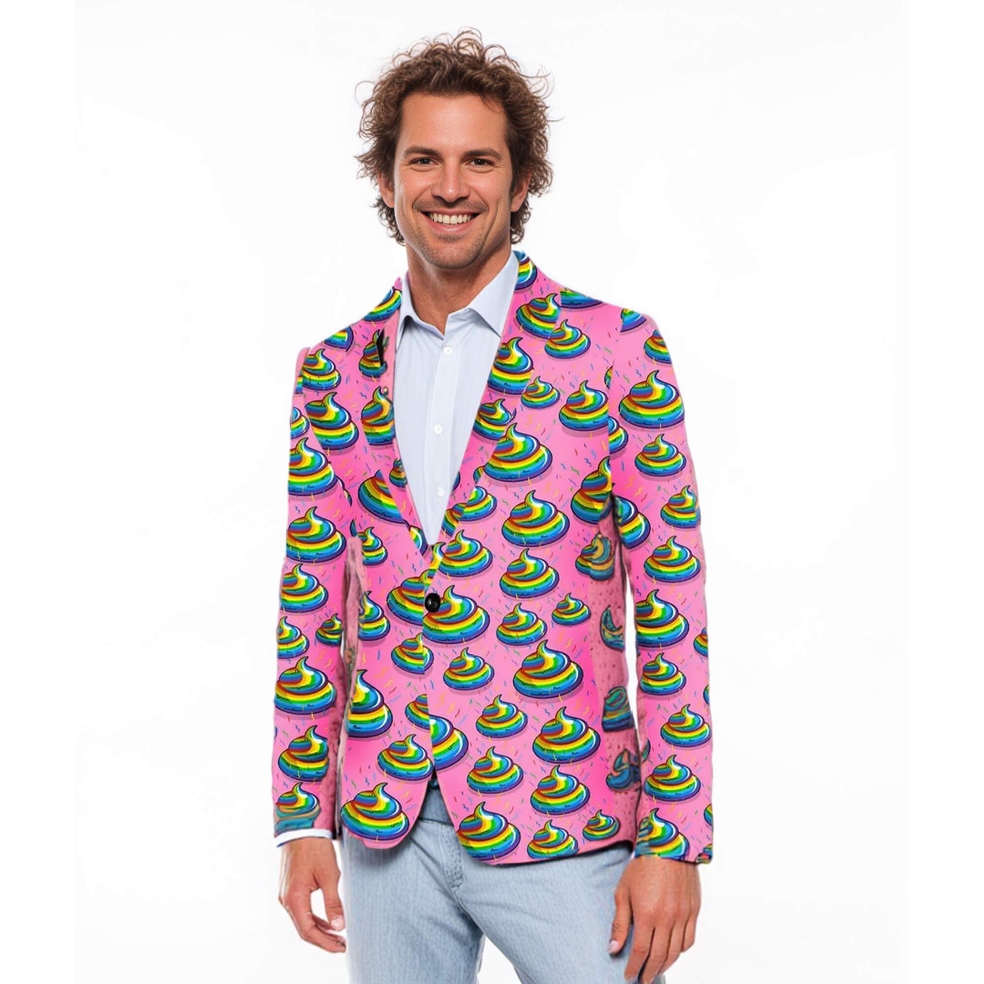 A smiling man models the Unicorn Poo Blazer, featuring a vibrant pink design with a rainbow poop emoji pattern. He pairs it with a light blue shirt and light pants, standing against a plain white background.