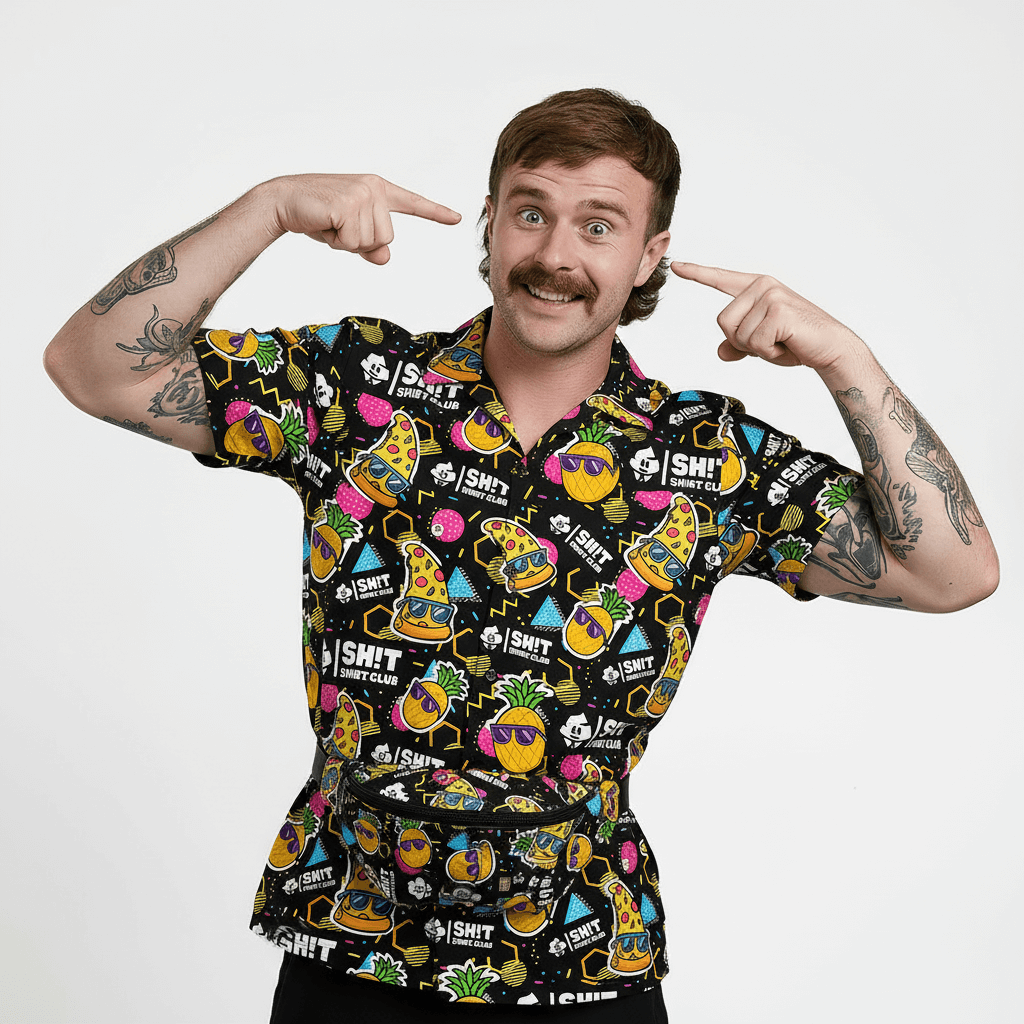 Person wearing a colourful patterned shirt with various designs on a plain background