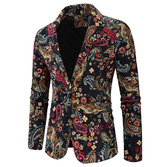 The Navy Floral Blazer is a slim-fit, single-breasted suit jacket featuring a vibrant multicolored paisley and floral pattern on a black background, notched lapel, and two-button closure—ideal for bold mens fashion.