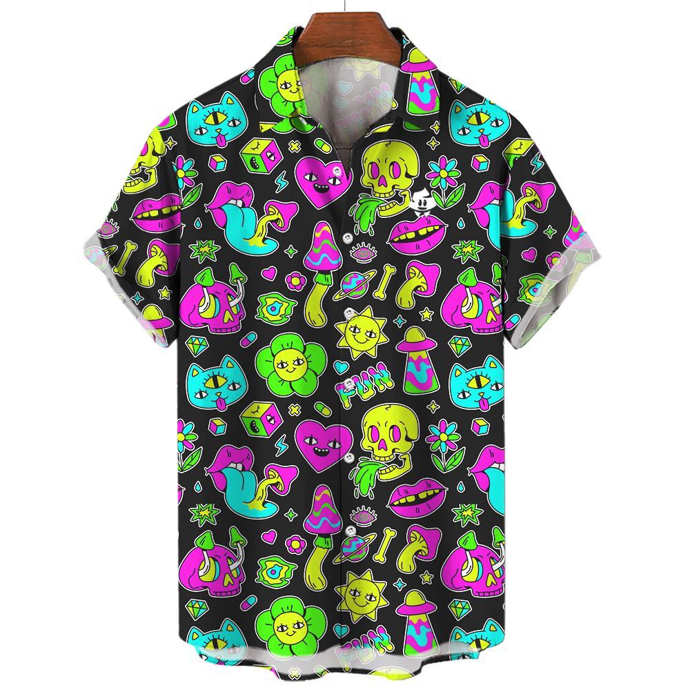 The Black Out Mushroom Shirt is a short-sleeve button-up with a black background, covered in vibrant neon cartoon skulls, cats, dice, mushrooms, flowers, eyes, and stars—a bold pick for festival style.