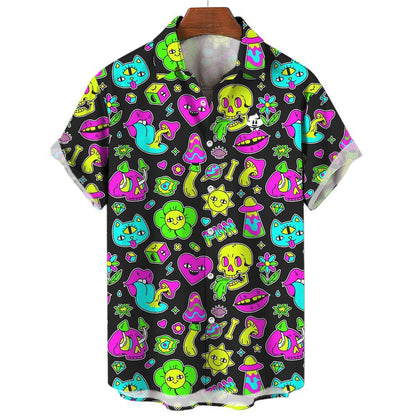 The Black Out Mushroom Shirt is a short-sleeve button-up with a black background, covered in vibrant neon cartoon skulls, cats, dice, mushrooms, flowers, eyes, and stars—a bold pick for festival style.