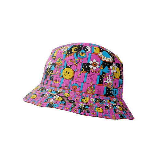 The Trippy Space Bucket Hat features a bright pink base with playful cartoon graphics like smiley faces, peace signs, stars, and flowers—making it a fun, psychedelic accessory for festivals.