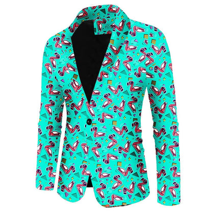 The Flamingo Fandango Blazer features playful pink flamingos, sunglasses, and vibrant shapes on turquoise, with a black inner lining and single button closure—a bold, fun statement jacket.