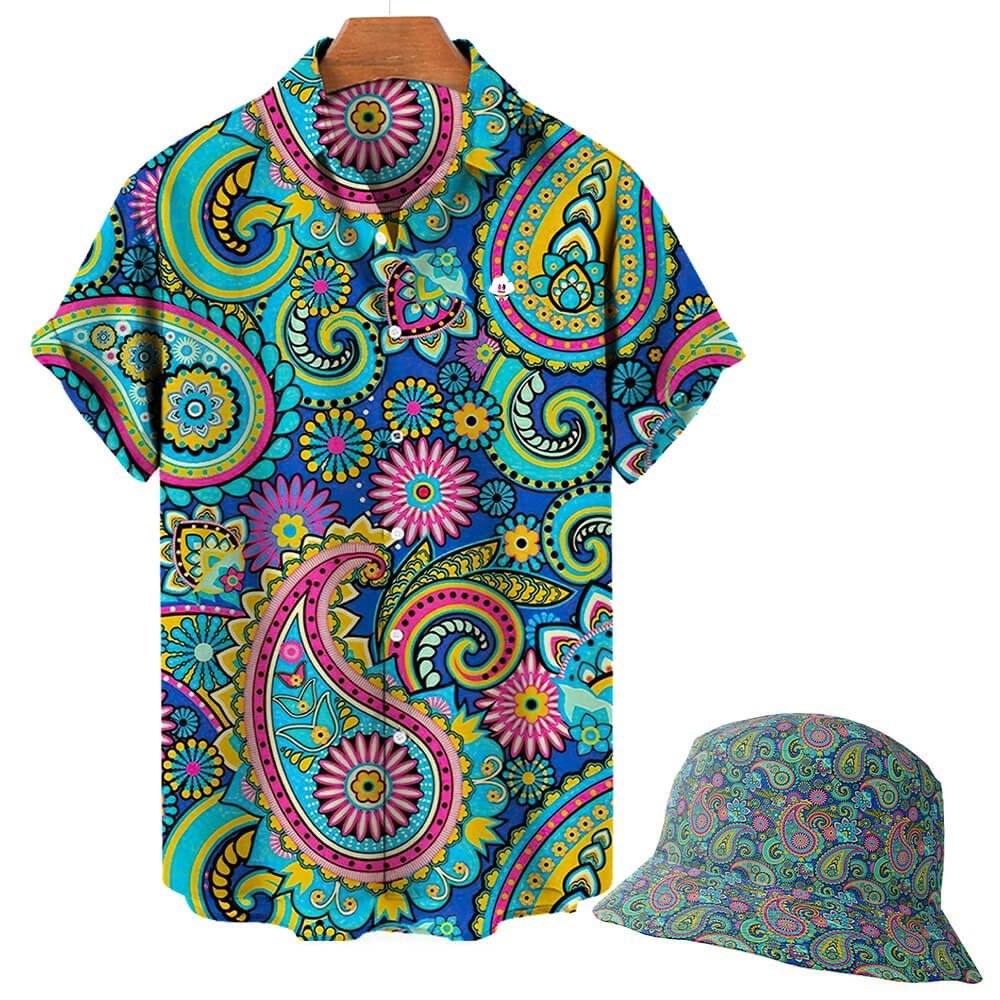 A short-sleeve button-up shirt and the Psychedelic Explorer Bucket Hat, both with a vibrant multicolored paisley and floral pattern in blue, yellow, pink, and green, displayed on hangers against a white background.